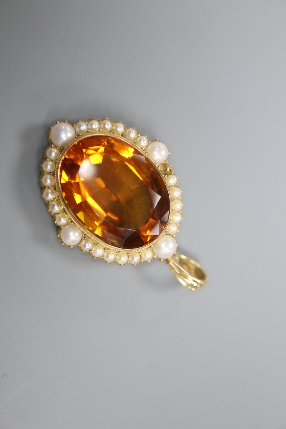 A citrine and seed pearl pendant, stamped 15ct, 3.5cm excluding 14k suspension loop,